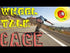 Skateboarder riding down a road with vibrant text overlay 'Wheel Talk Cage'.